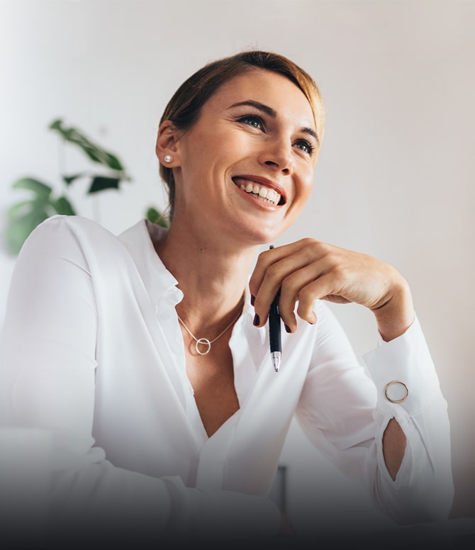 Mature woman in shirt and smiling at a meeting