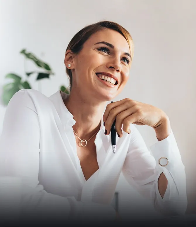 Mature woman in shirt and smiling at a meeting