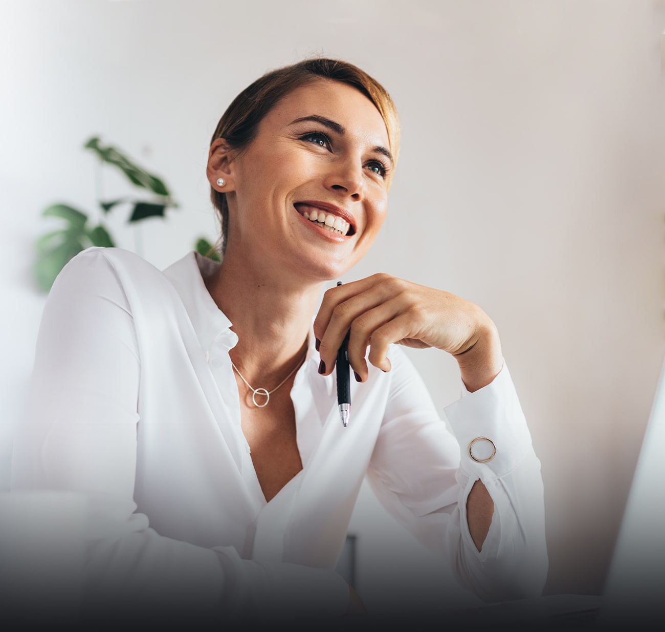 Mature woman in shirt and smiling at a meeting